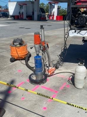 Core drilling equipment with caution tape.