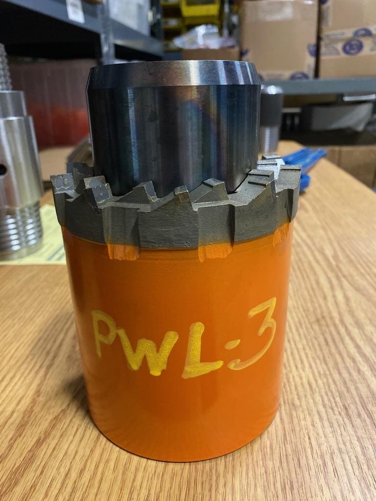 Orange drill bit with "PWL-3" label.